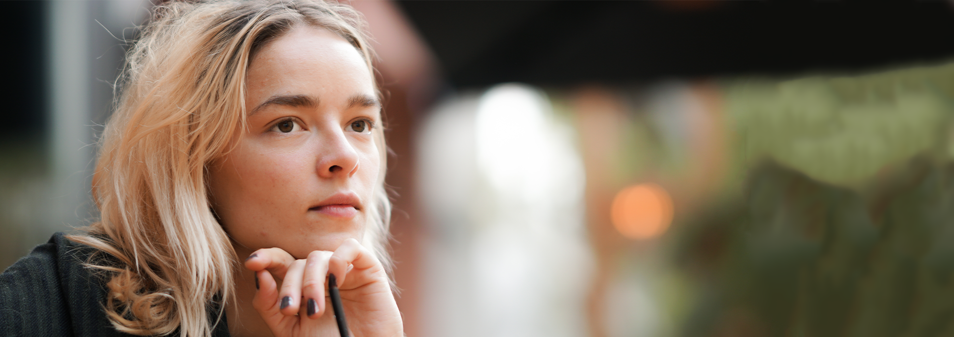 Young woman thinking about her pregnancy test results